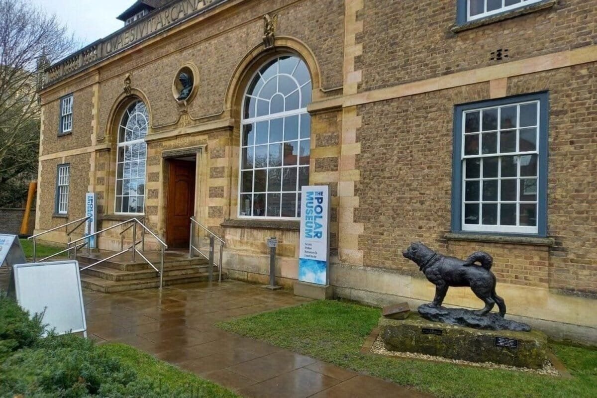 The Scott Polar Museum front entrance featuring a statue of a Husky Sledge Dog.