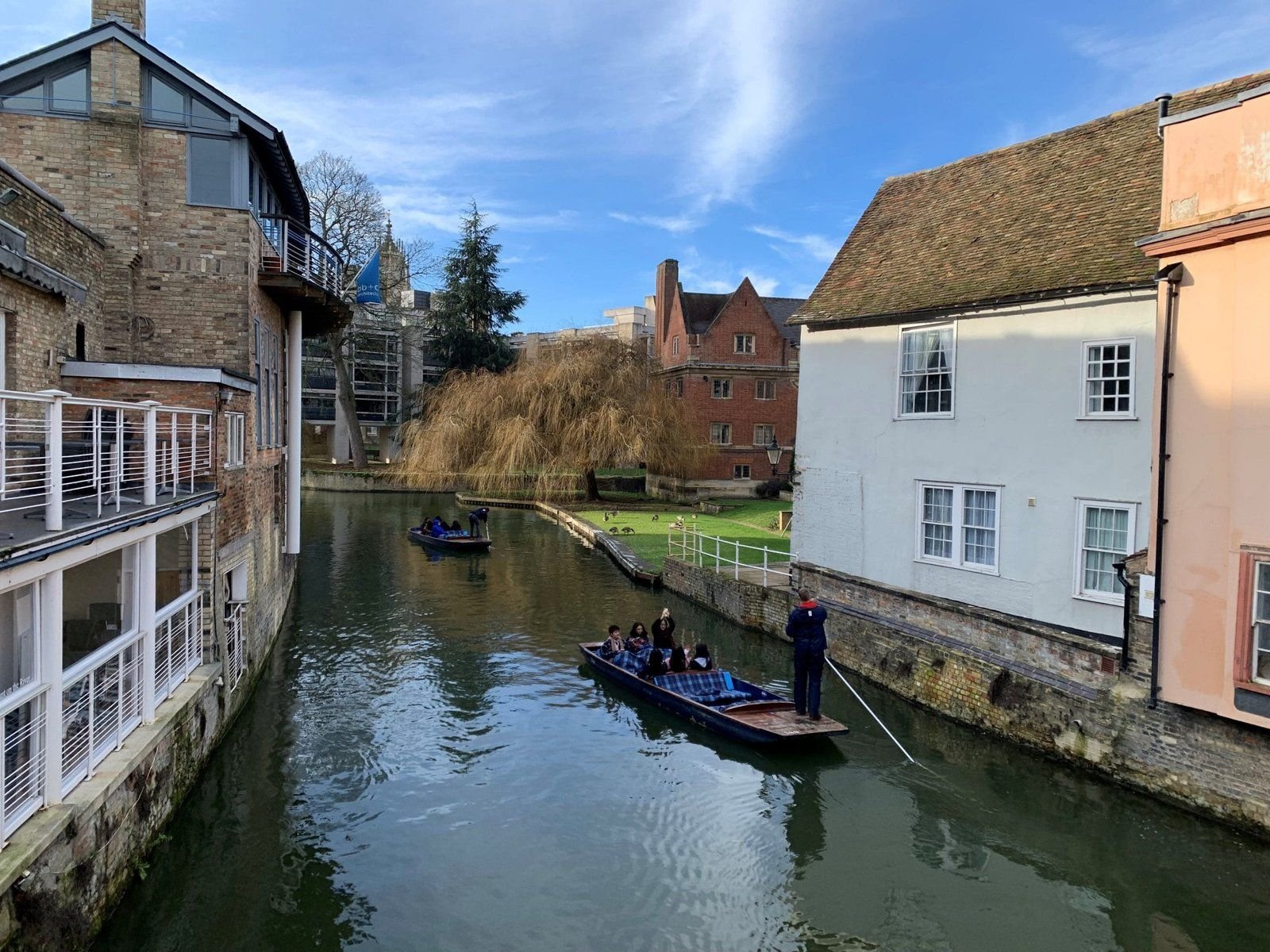 Romance in Cambridge . Punting down the River Cam
