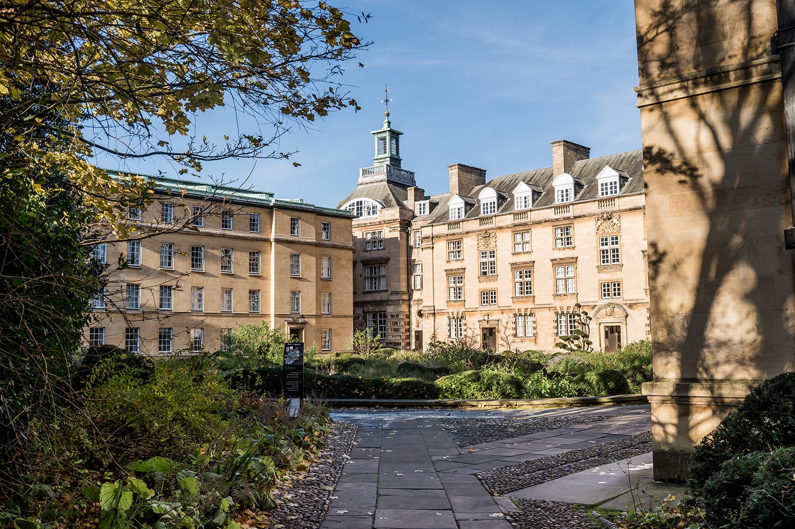 Christ's College, Cambridge Third Court on a sunny Autumn Day. Photo by Damien Vickers Photography.