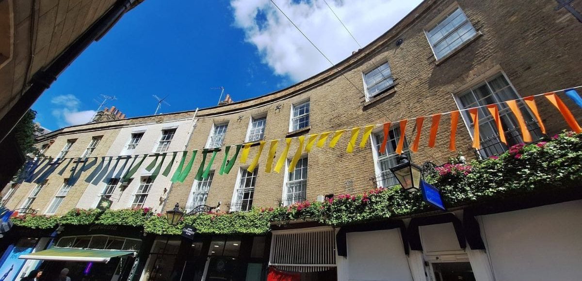 Rose-Crescent-Cambridge Rose Crescent in the sunshine with brightly coloured bunting.