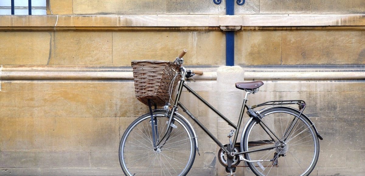 Bike in Cambridge A black bike against a beige wall in Cambridge
